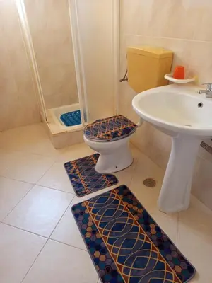 a bathroom with a toilet and a sink at Appartamento Gianni in Santa Maria