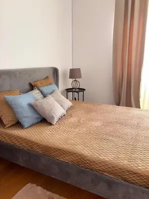 a bed with pillows on it in a bedroom at Prainha Beach House in Praia
