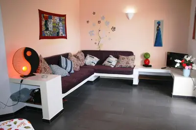 a living room with a couch and a tv at Endless Summer B6 in Sal Rei