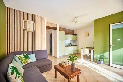a living room with a couch and a table at Tropical Casa Verde Santa Maria G01 in Santa Maria