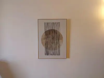 a picture hanging on a white wall with black lines at SeafrontView - Cozy T1 Apartment 3 in Praia