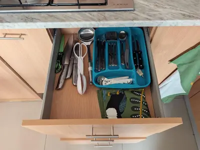a drawer with a blue tray in a kitchen at SeafrontView - Cozy T1 Apartment 3 in Praia