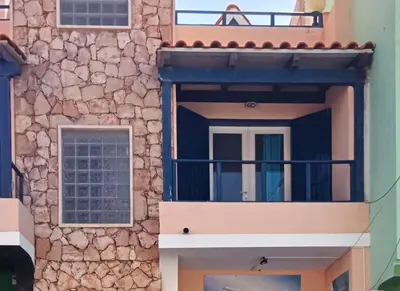 a building with a balcony in front of it at Canova Apartment in Santa Maria