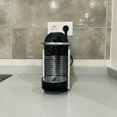a black and white appliance plugged into a light switch at Sal Little Heart Blue Apartment 13 in Santa Maria