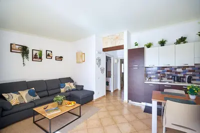 a living room with a couch and a table at Tropical Miradouro in Santa Maria