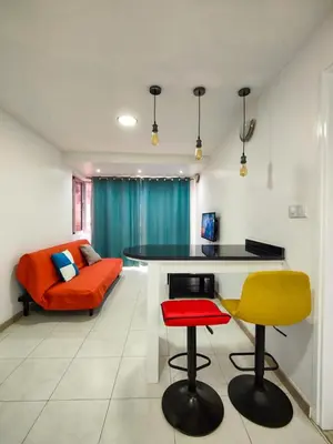 a living room with a table and two chairs at LAR DO VIAJANTE, Ribeira Grande Santo Antão in Ribeira Grande