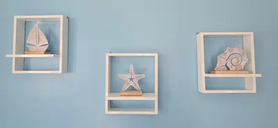 a shelf with two mirrors and a starfish on it at Ocean Breeze in Sal Rei