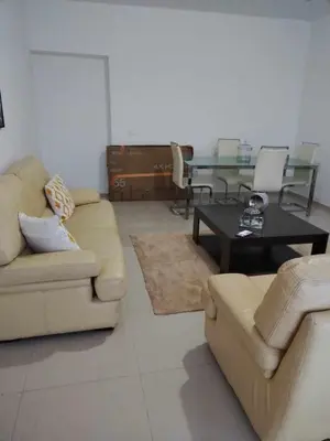 a living room with a couch and a table at Residencia Moreno in Praia