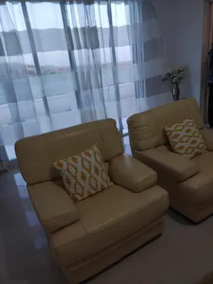 a living room with a couch and a chair at Residencia Moreno in Praia