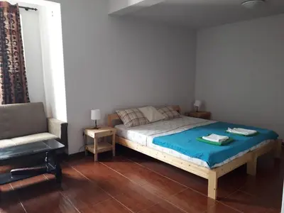a bedroom with a bed and a chair in it at Maya Mindelo 4 in Mindelo