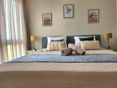 a bedroom with a large bed with pillows on it at Boa Mindelo Azul in Mindelo