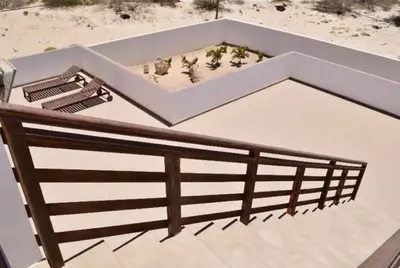 an overhead view of a deck with benches and a fence at Casa Estoril, Boa Vista in Sal Rei