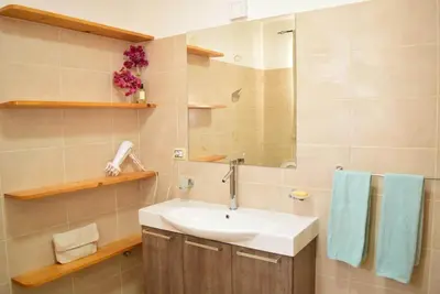 a bathroom with a sink and a mirror at Casa Estoril, Boa Vista in Sal Rei