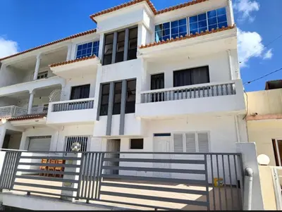 a white house with a staircase in front of it at Casa Shell in Tarrafal