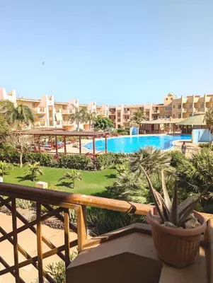 a view of the pool from the balcony of a resort at TOP POOL VIEW - Tropical Apt B11 - PointingCaboVerde in Santa Maria
