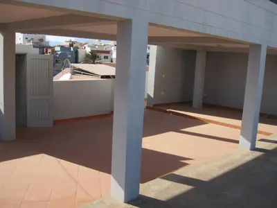 a balcony of a building with two white columns at Maya Mindelo 2 in Mindelo