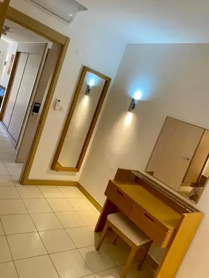 a bathroom with a vanity and two mirrors on the wall at condomínio vila verde Pepper, Cactus T0,T1,T2 in Santa Maria