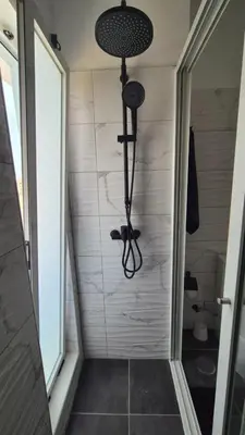 a small bathroom with a shower with at Appartamenti Praia Estoril, Sal Rei, Boa Vista in Sal Rei