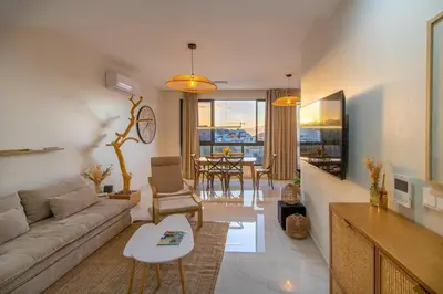 a living room with a couch and a table at HouseLux JJL in Mindelo