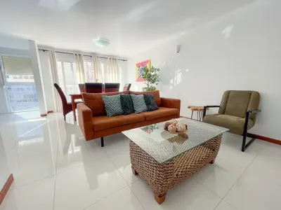 a living room with a couch and a table at Marel Bliss Apartments T2 Lorena in Mindelo