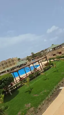 a view of a large building with a green park at T&C No Stress apartment in Santa Maria