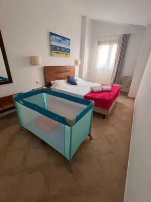 a hotel room with a bed and avertisement at Brisa Tropical in Santa Maria