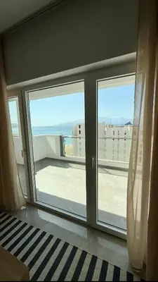 a room with a large window with a view of the ocean at Laginha Paradise II - Penthouse in Mindelo