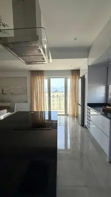 a kitchen with a stove top oven in a room at Laginha Paradise II - Penthouse in Mindelo
