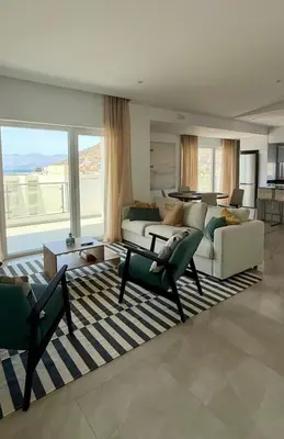a living room with a couch and a table at Laginha Paradise II - Penthouse in Mindelo