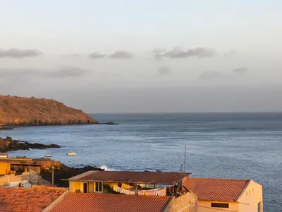 a view of a body of water with buildings at Old Town view Apartment in Cidade Velha