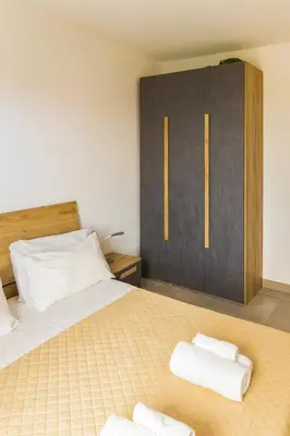 a bedroom with a bed with two towels on it at Ocean View Luxury in Santa Maria