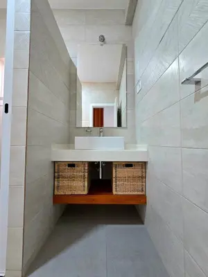 a bathroom with a sink and a mirror at Casa Bela in Mindelo