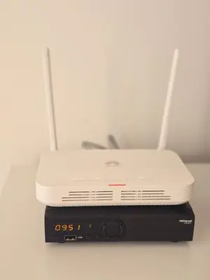a white router sitting on top of a modem at Casa Bela in Mindelo
