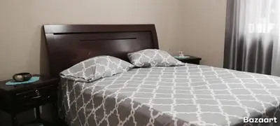 a bed with two pillows on it in a bedroom at NoS Casa in Montanha