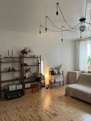 a large living room with a bed and a table at Apt Martins May 2 in Vila do Maio