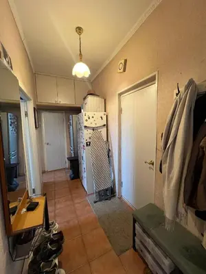 a room with a hallway with a kitchen and a door at Apt Martins May 2 in Vila do Maio