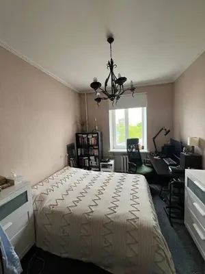 a bedroom with a bed and a desk and a window at Apt Martins May 2 in Vila do Maio