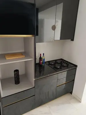 a kitchen with a stove and a counter top at Apartamento Praia JOIA in Praia