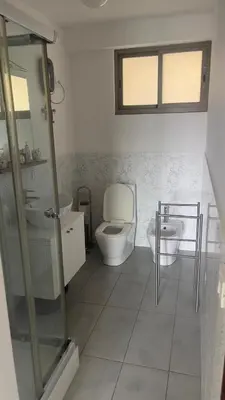 a bathroom with a toilet and a sink at Apartamento T1 - Hotel Las Rochas in Mindelo