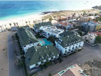 an aerial view of a resort and the beach at Leme Bedje Residence in Santa Maria