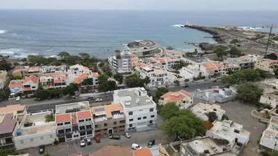 an aerial view of a town next to the ocean at Our Happy Place Prainha in Praia