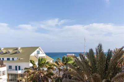 a view of the ocean from a building at Atlantic Sal Ocean View in Santa Maria