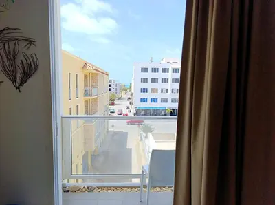 a window with a view of a city street at Boadream Casa Duria Porta Rossa in Prainha