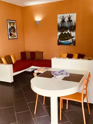 a living room with a couch and a table at Cala da Lua apartments in Sal Rei