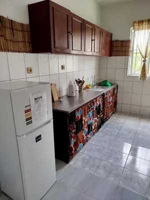 a kitchen with a refrigerator and a counter top at Kasa Sirena in Tarrafal
