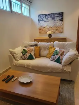 a living room with a couch and a coffee table at Apartamento Silva 1 in Praia