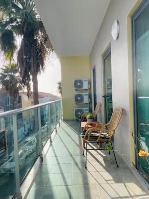 a balcony of a building with two chairs on it at Sal Little Heart Bia Apartment 19 in Santa Maria
