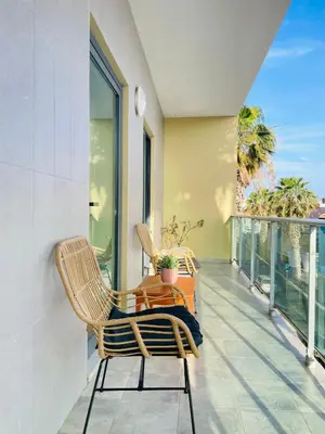 a balcony with two chairs and a table at Sal Little Heart Bia Apartment 19 in Santa Maria