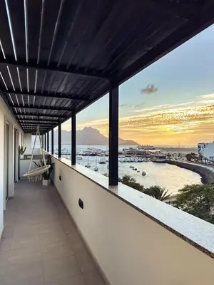 a balcony with a view of the ocean at Marina Mindelo Bay View in Mindelo