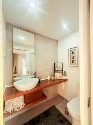 a bathroom with a large mirror and a tub at Marina Mindelo Bay View in Mindelo